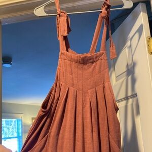 Rust colored jumper, size small. NWT.